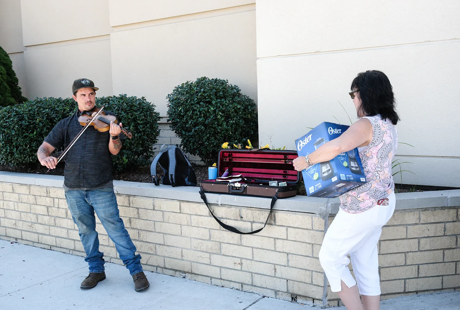 From troubled past to busking with a violin