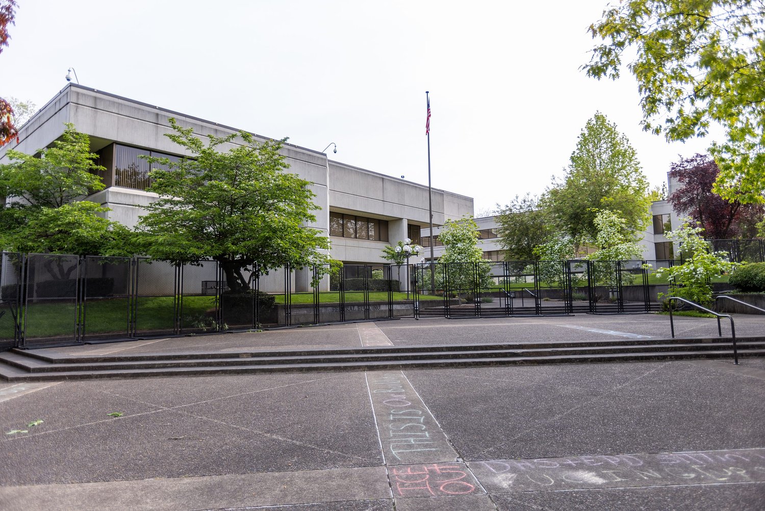 Activists sue, saying fence at Eugene Federal Building violates basic rights