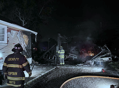 Garage, outbuildings, motor home, vehicles involved in fire Sunday in Lockport Township
