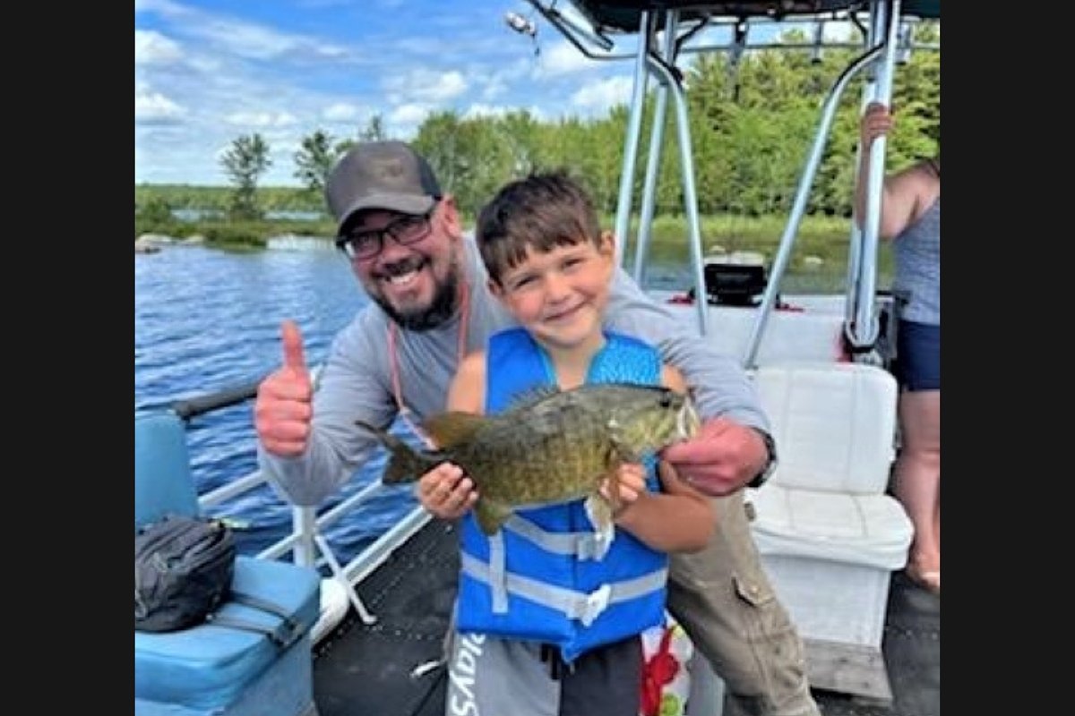 A kid’s 1st fish nearly snapped his rod