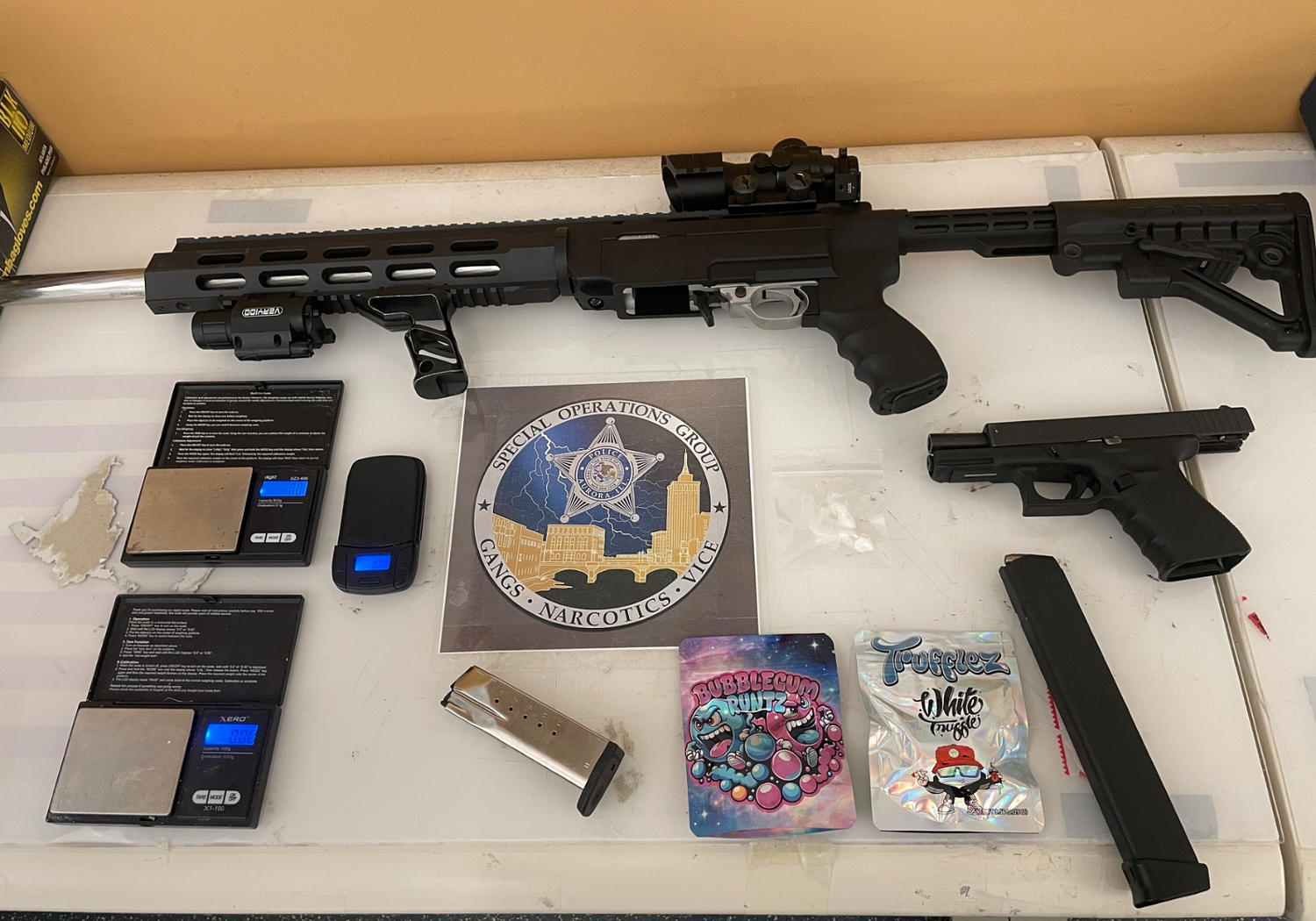 Aurora police say they found stolen, loaded handgun and drugs during traffic stop; local man charged
