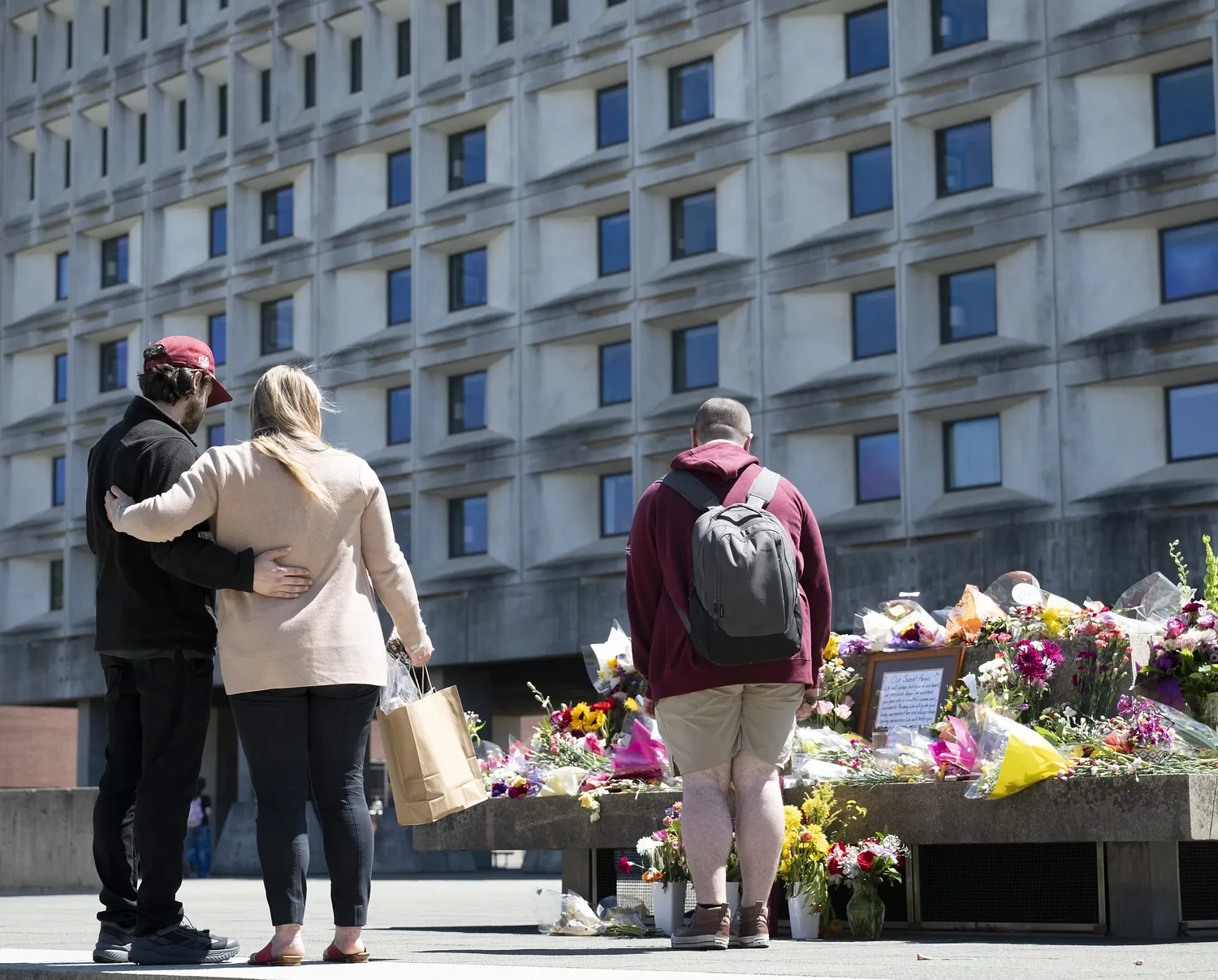 Memorial grows at UMass hotel for slain worker