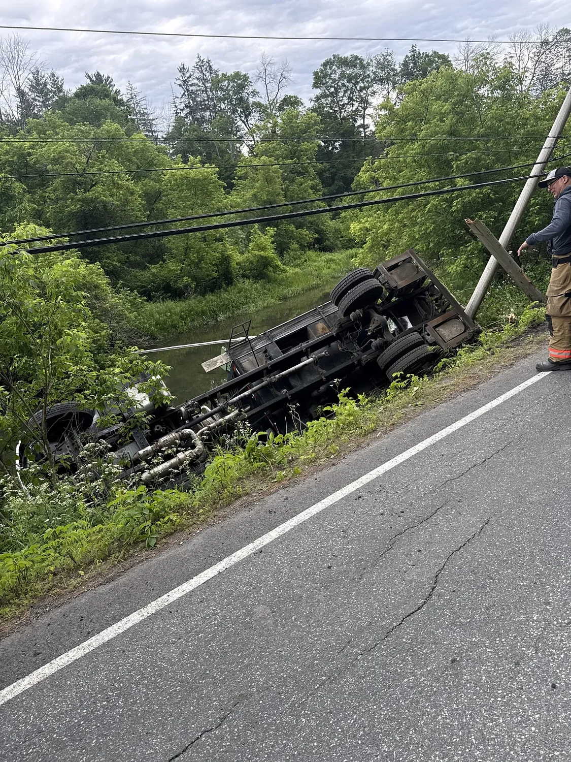 Update: Cleanup ongoing in Woodstock after truck crashes along river