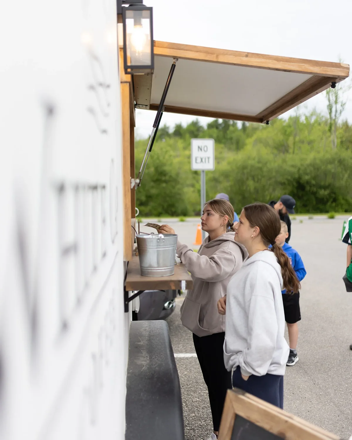 Community rallies at Food Truck Night to save Boynton Middle School sports