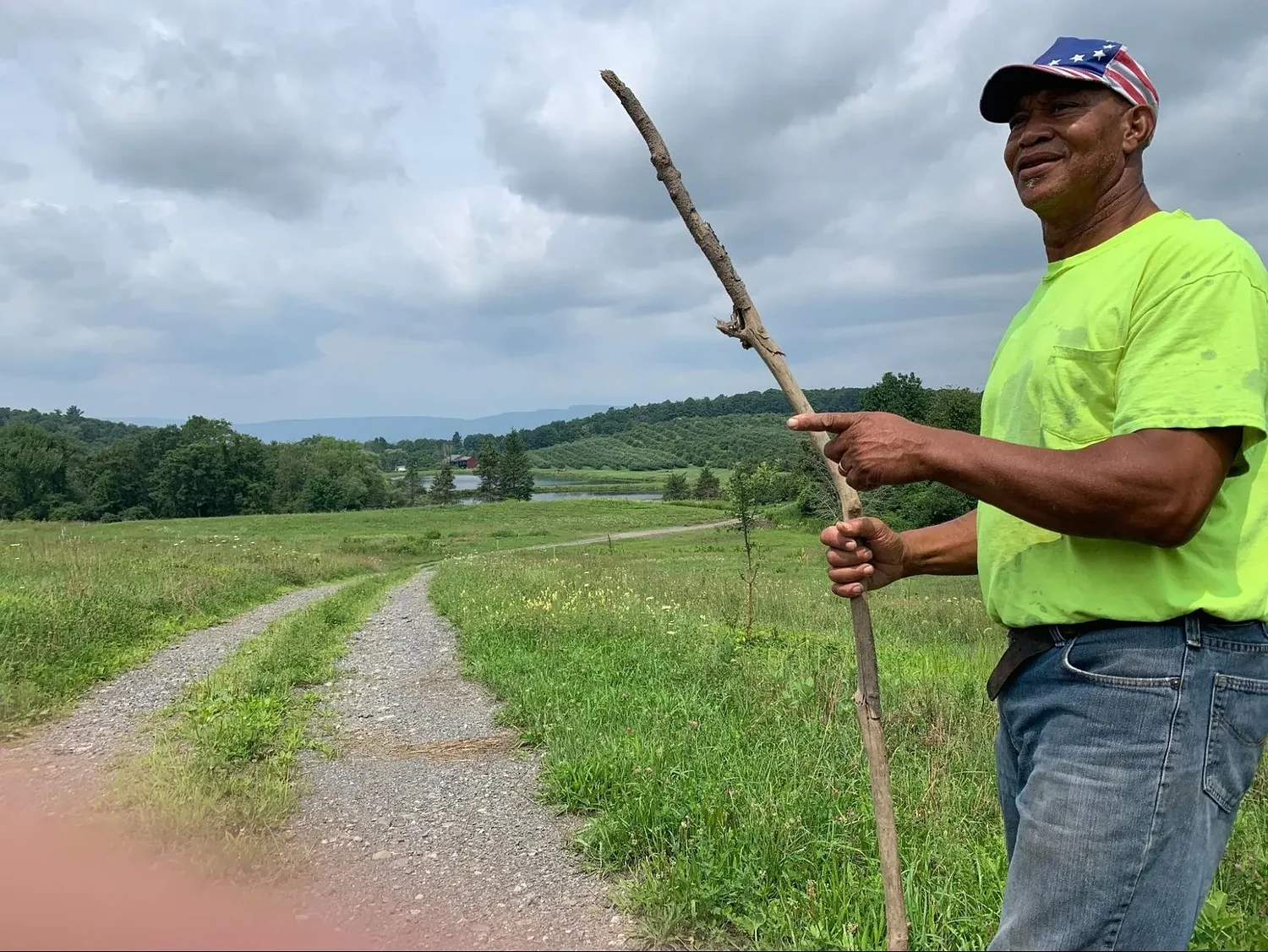 Facing fire and funding cuts, farmer fights to save his land