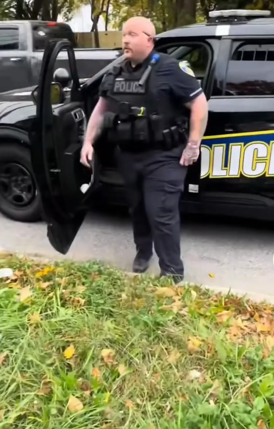 Baltimore police officer indicted after viral video shows him trying to hit man with patrol car