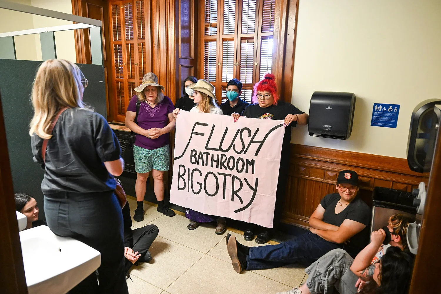 Texas is restricting the bathrooms trans people can use in government buildings. Here’s how the law works.