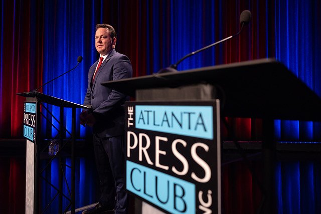 Burt Jones takes shots at absent rival on the debate stage as Rick Jackson hits the campaign trail