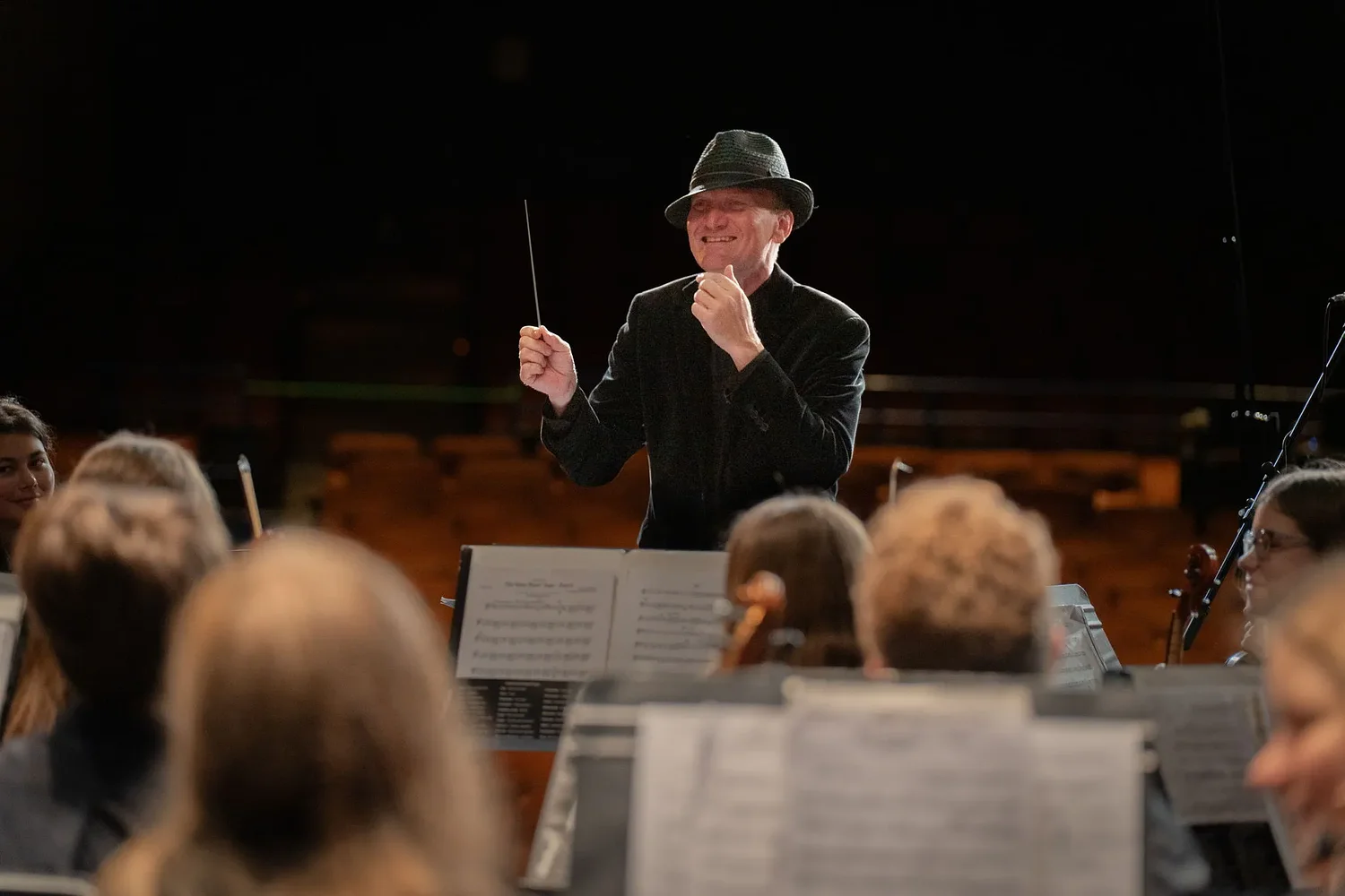 Christopher Noel conducts a community of young musicians