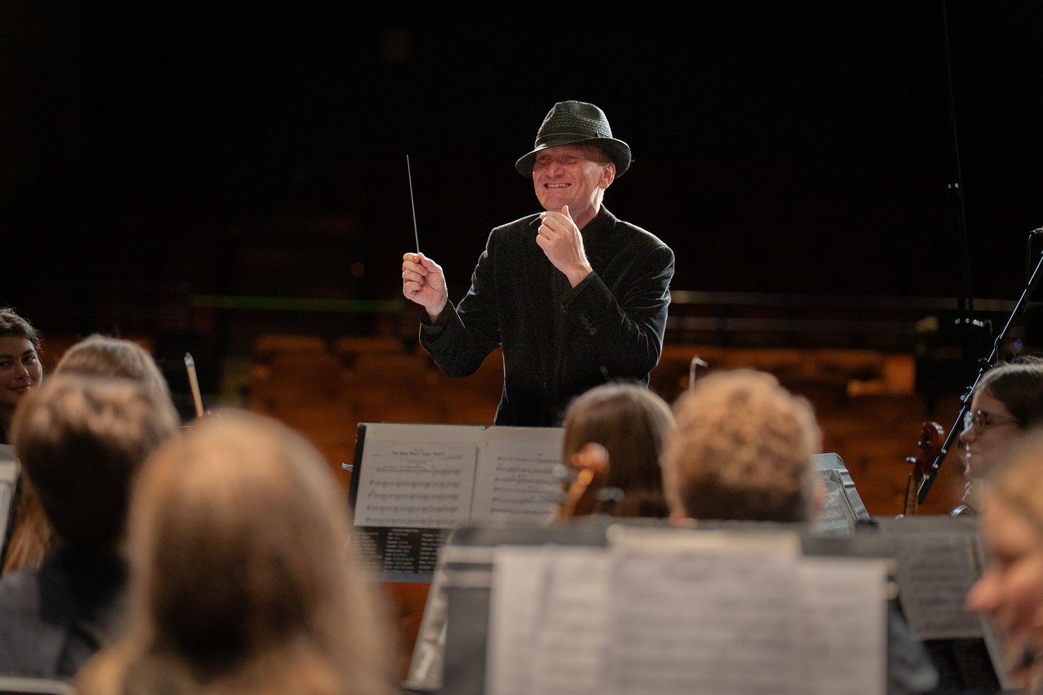 Christopher Noel conducts a community of young musicians
