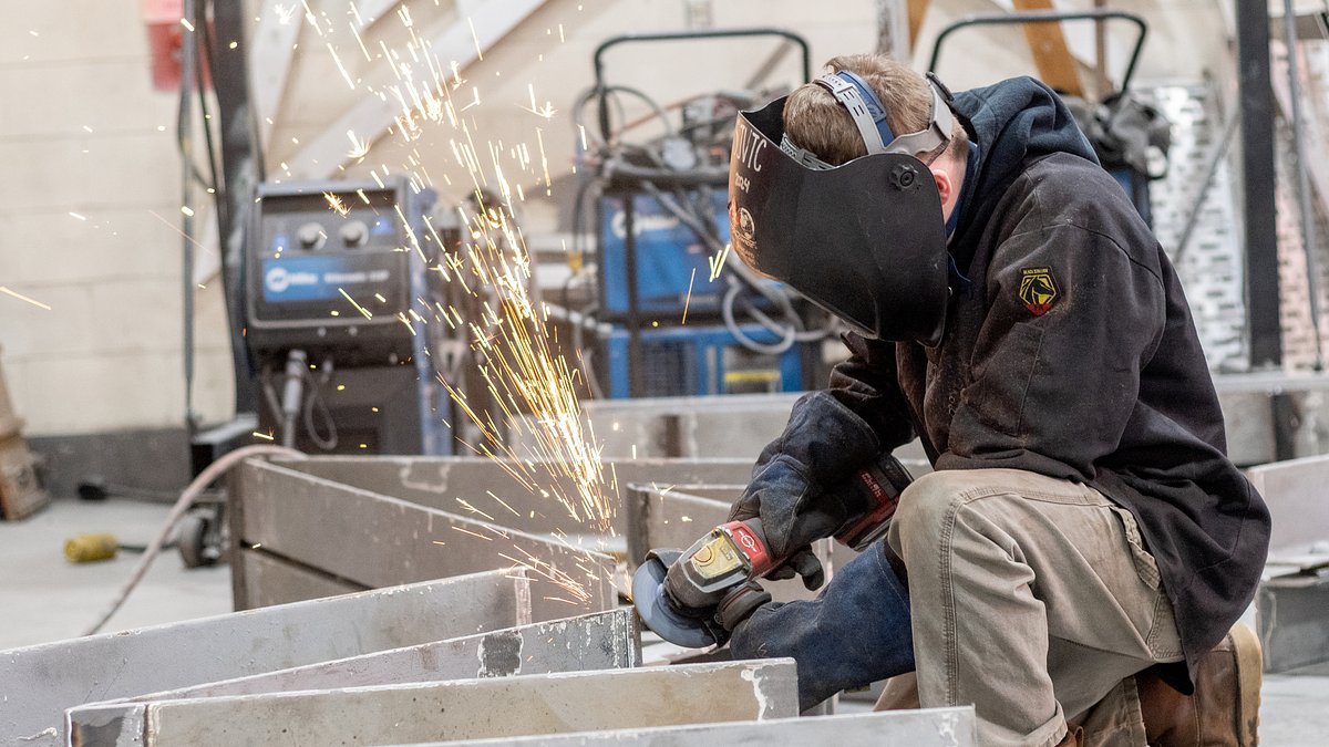 Tech students learn real-world skills while forging massive Acadian sculpture