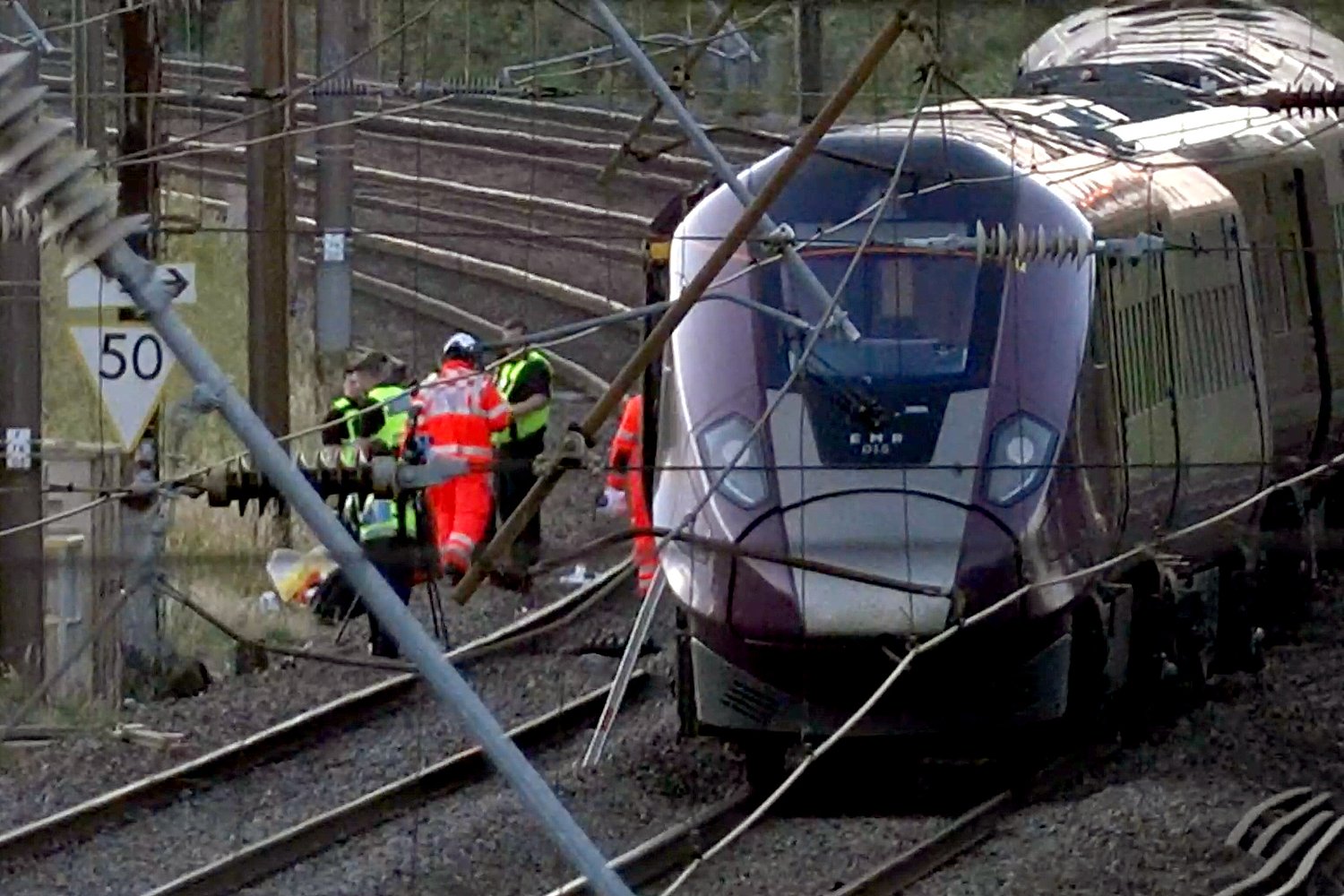 Two trains collide north of London, killing at least 1 person and seriously injuring dozens