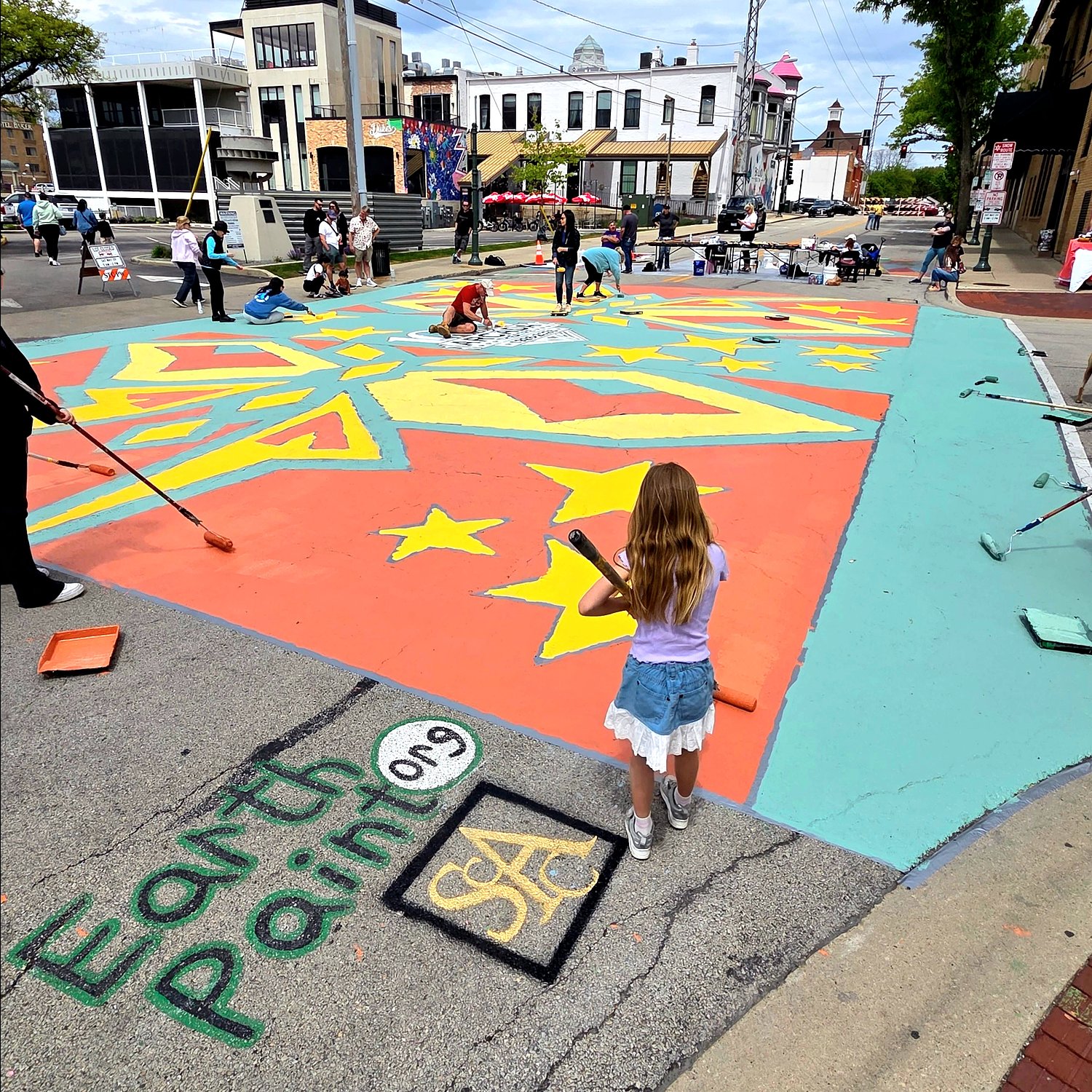 St. Charles community ‘paints the street’ for student’s visionary work