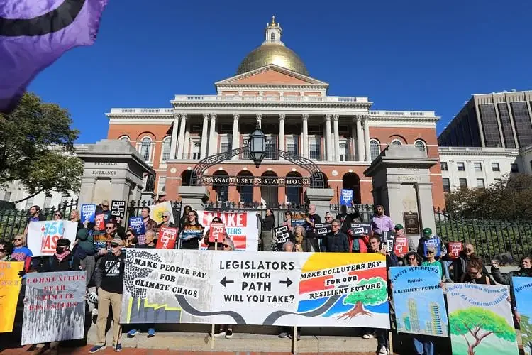 Rally attendees demand that fossil fuel companies pay for climate damage