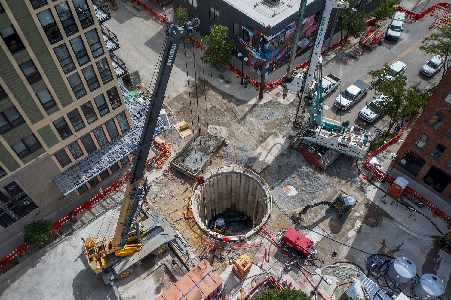 Watch crews dig a 30-foot pit in a downtown Ann Arbor intersection