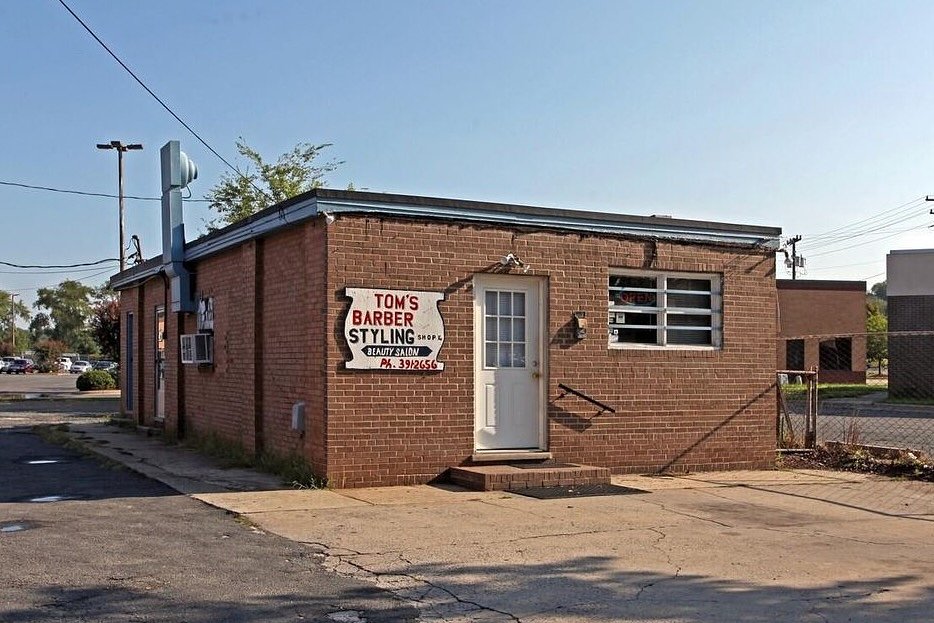 A building that once housed a landmark barbershop is sold in west Charlotte