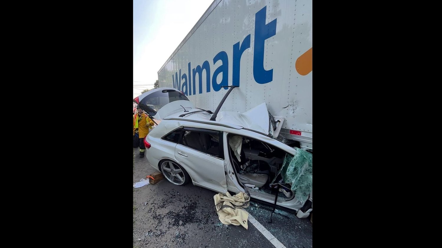 2 people rescued after car becomes wedged under Walmart truck in N.J. town