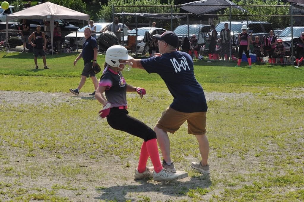 Greenville firefighters beat Hurricanes youth team in charity softball match