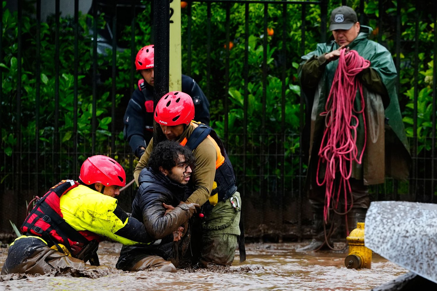 Heavy rain batters Chile’s capital, sweeping away cars and flooding homes