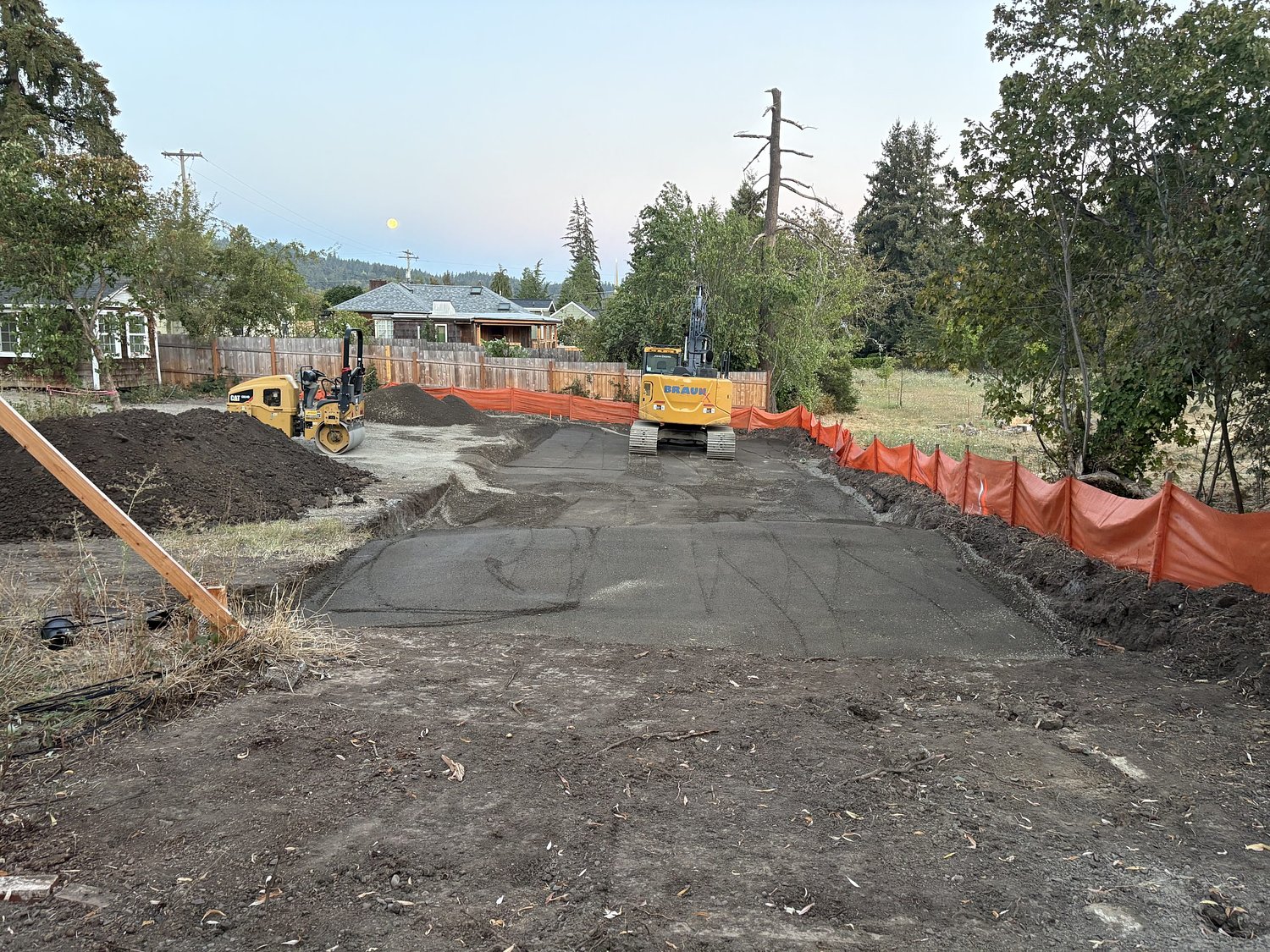 Bordering Madison Meadow, three houses go up where one once stood 