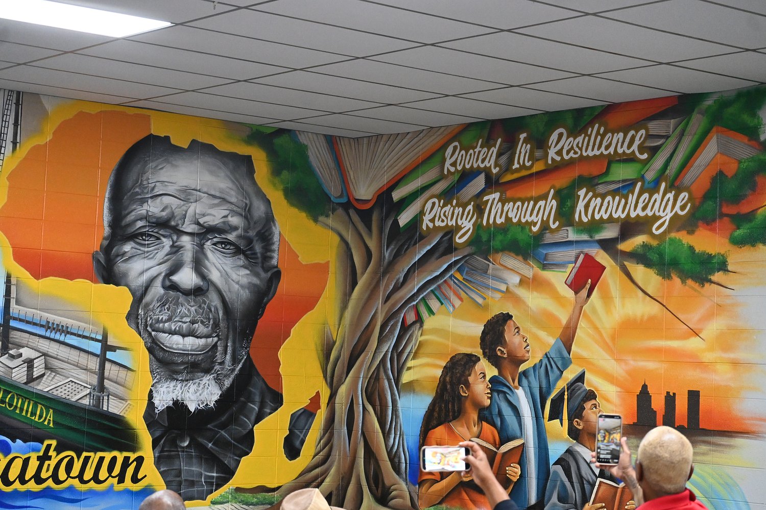 ‘Rooted in Resilience’: Africatown mural honors Clotilda survivors, inspires students