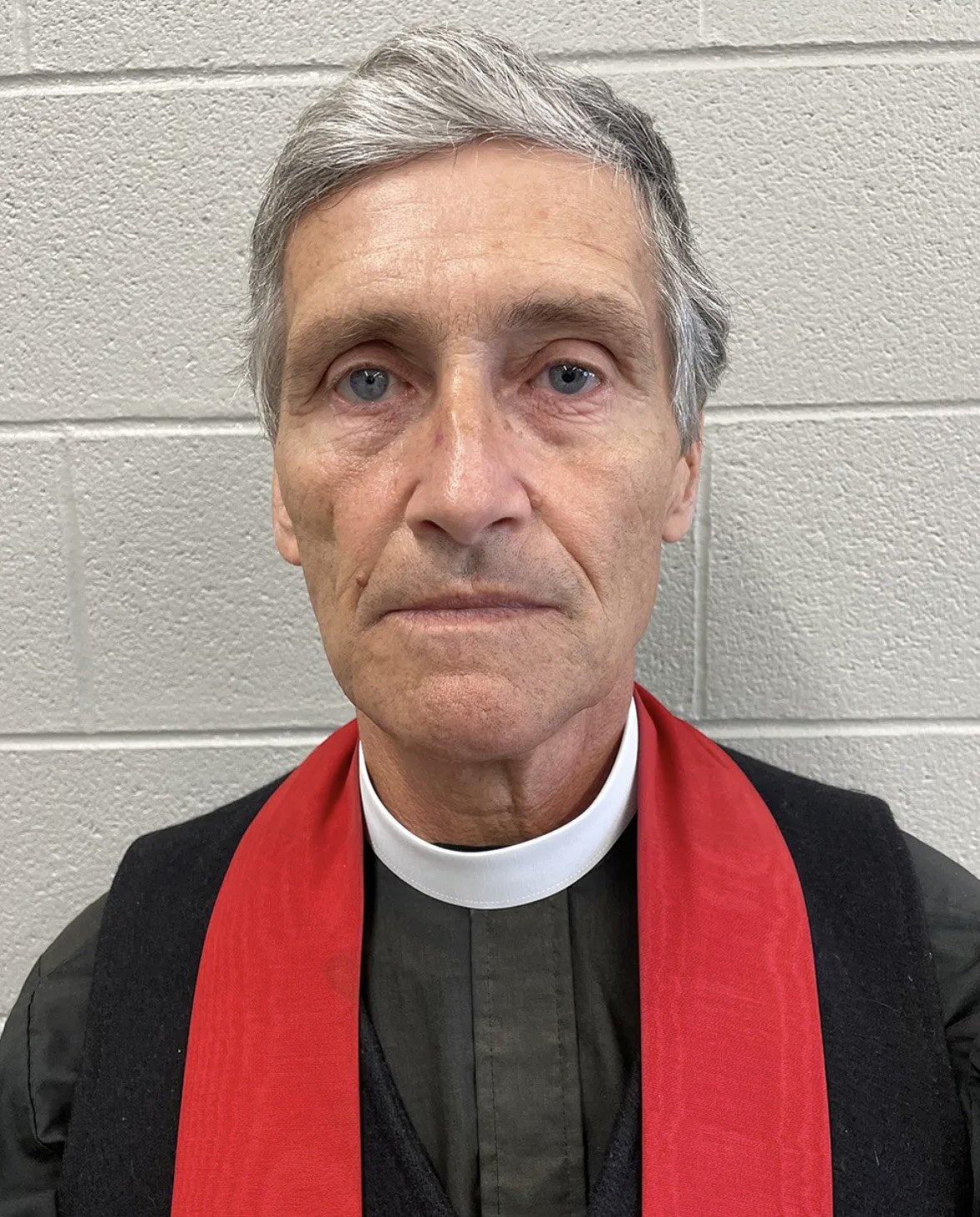 Local priest and six others face court after Williston ICE protest
