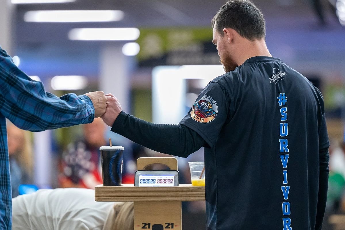 Survivors of Lewiston mass shooting mark anniversary, honor victims with cornhole tournament