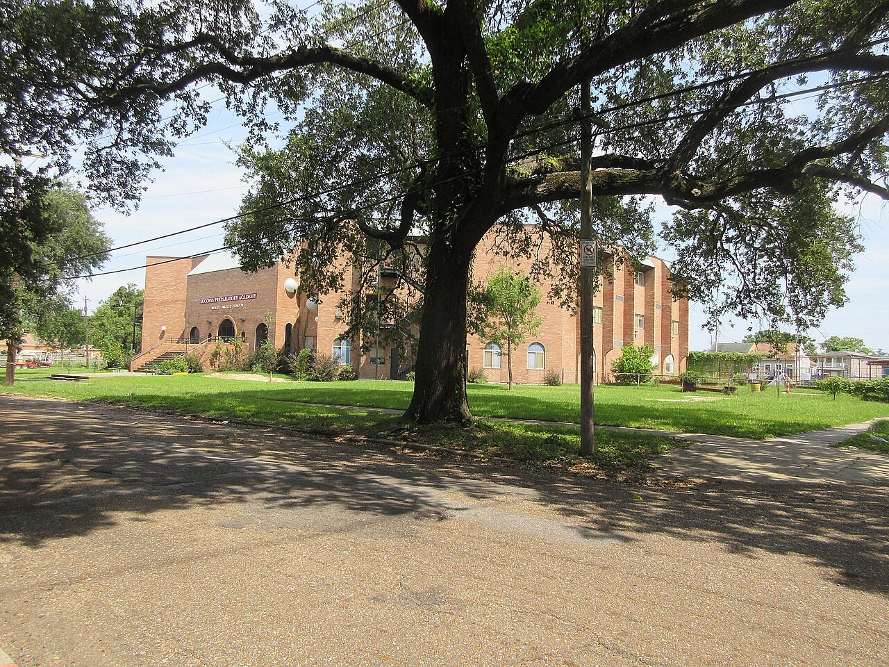 Who was Albert Wicker and why was a school renamed for him?