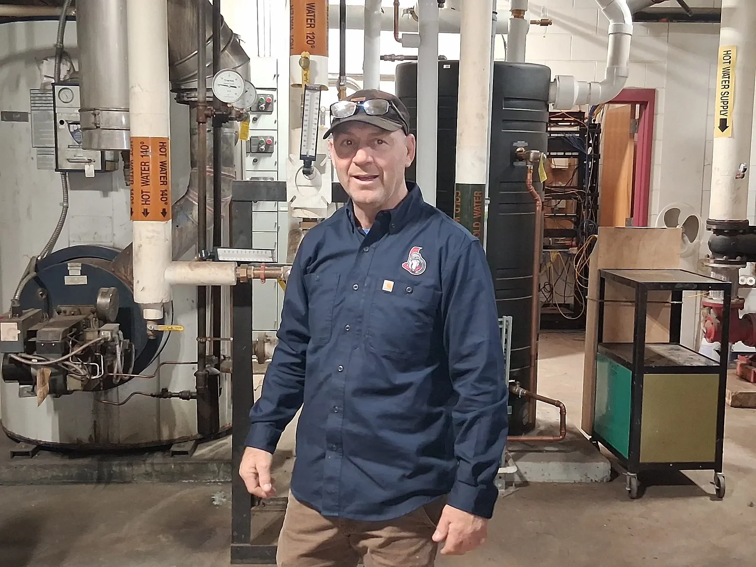 MassCEC officials tour Mahar to talk ventilation, water heating upgrades