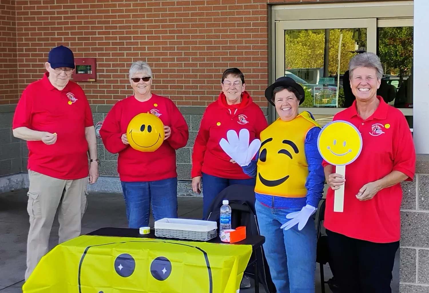 Congregational Church members hand out stickers for World Smile Day