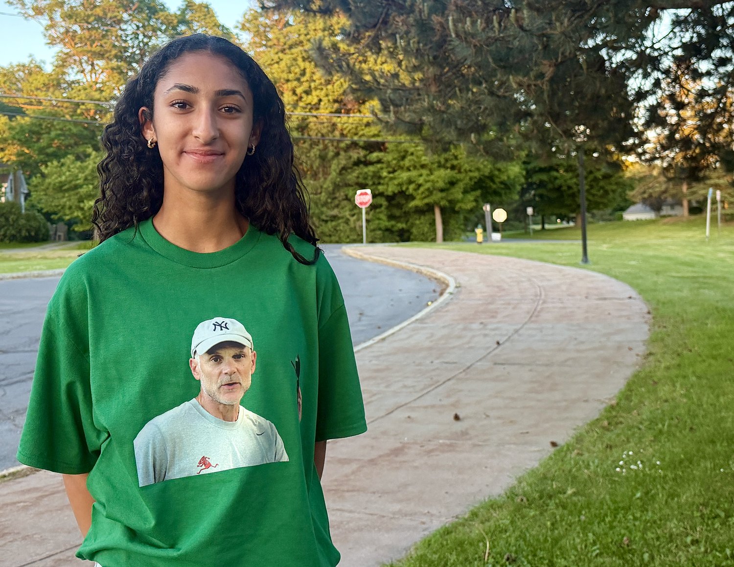 Supporters of suspended cross country coach Bill Aris pack school board meeting