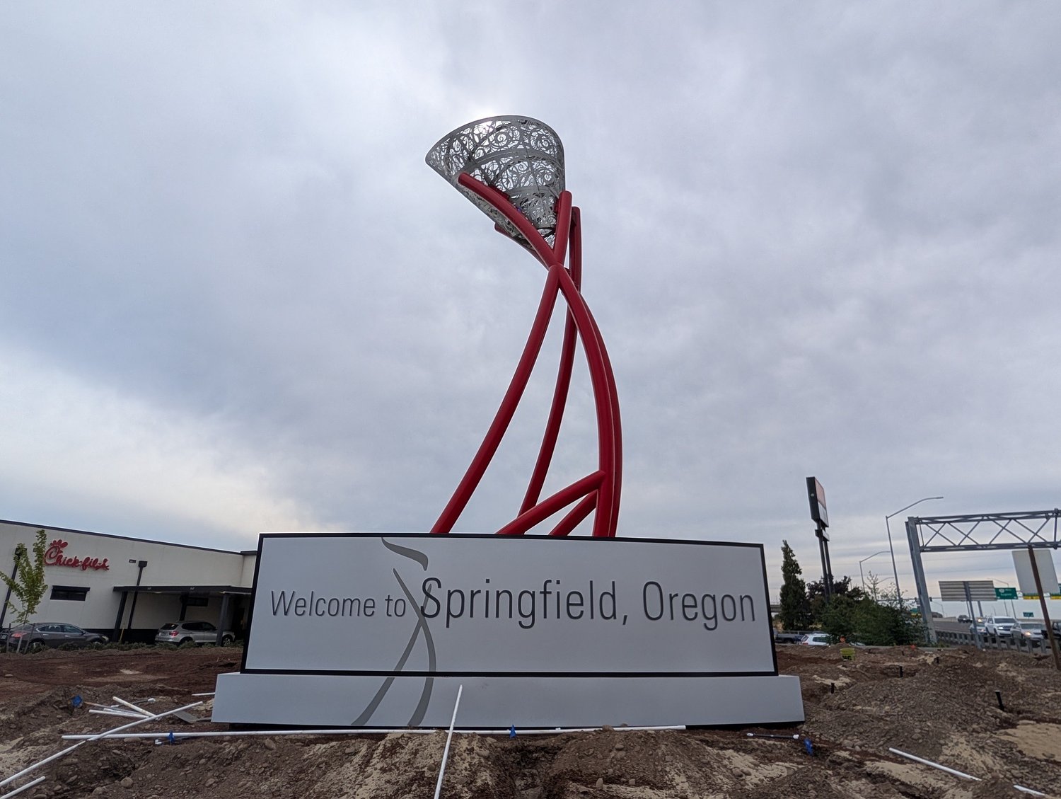 City installs ‘Welcome to Springfield’ sign on Gateway Street by ‘Flame’ scupture