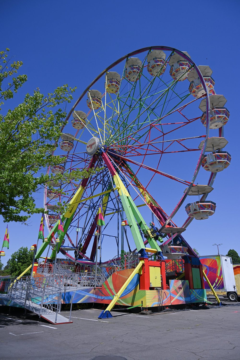 At the Lane County Fair, where do rides come from and how do they get set up?