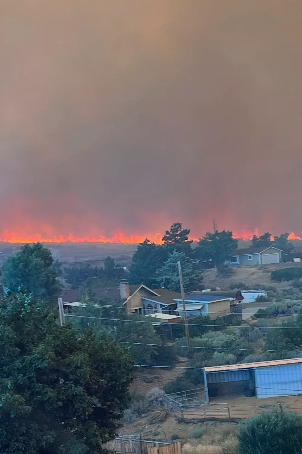 Fast-moving wildfire amid shifting winds threatens Reno, Nevada, forcing thousands to evacuate