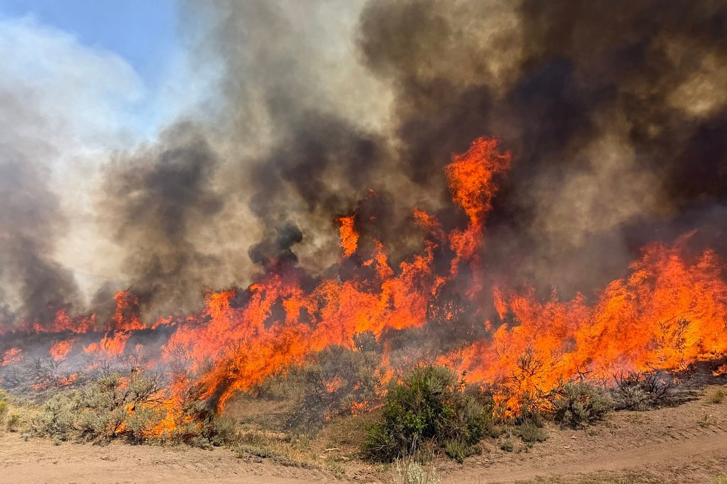 A helicopter battling a Utah wildfire crashes with no word on the 2 people aboard