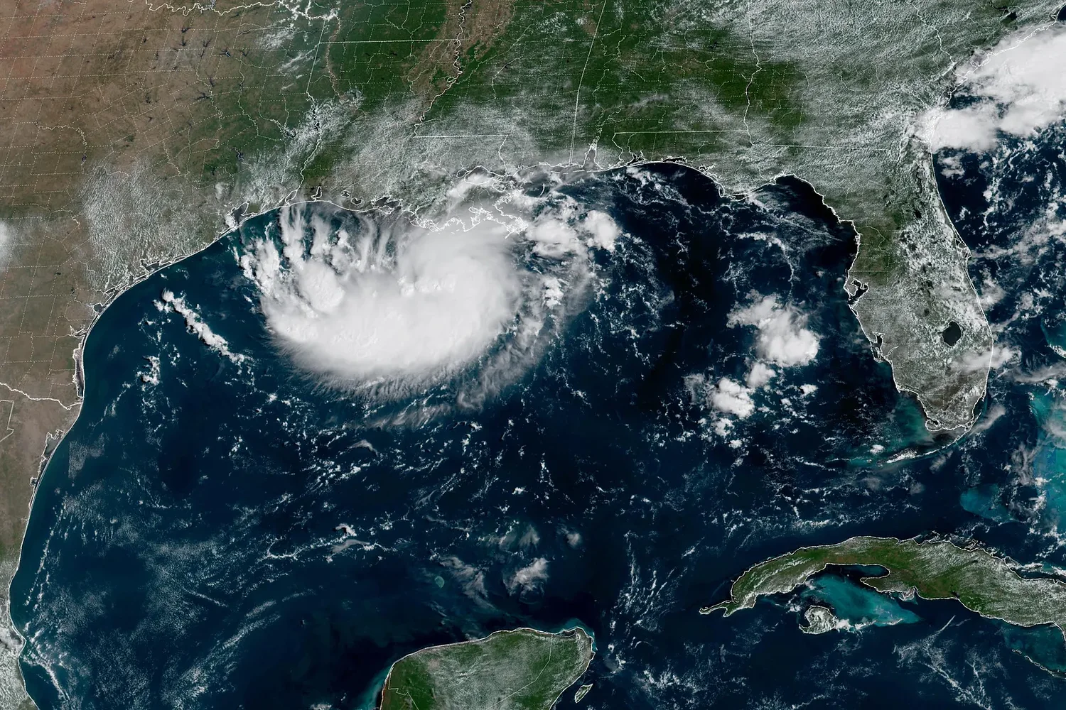 Tropical Storm Edouard heads for Texas and Louisiana while a storm moves toward Hawaii