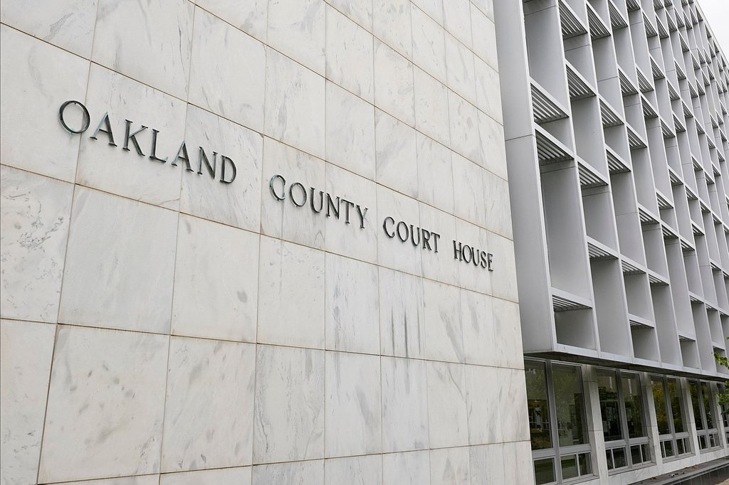 Michigan woman pleads no contest to abuse after 3 kids are found living alone for years
