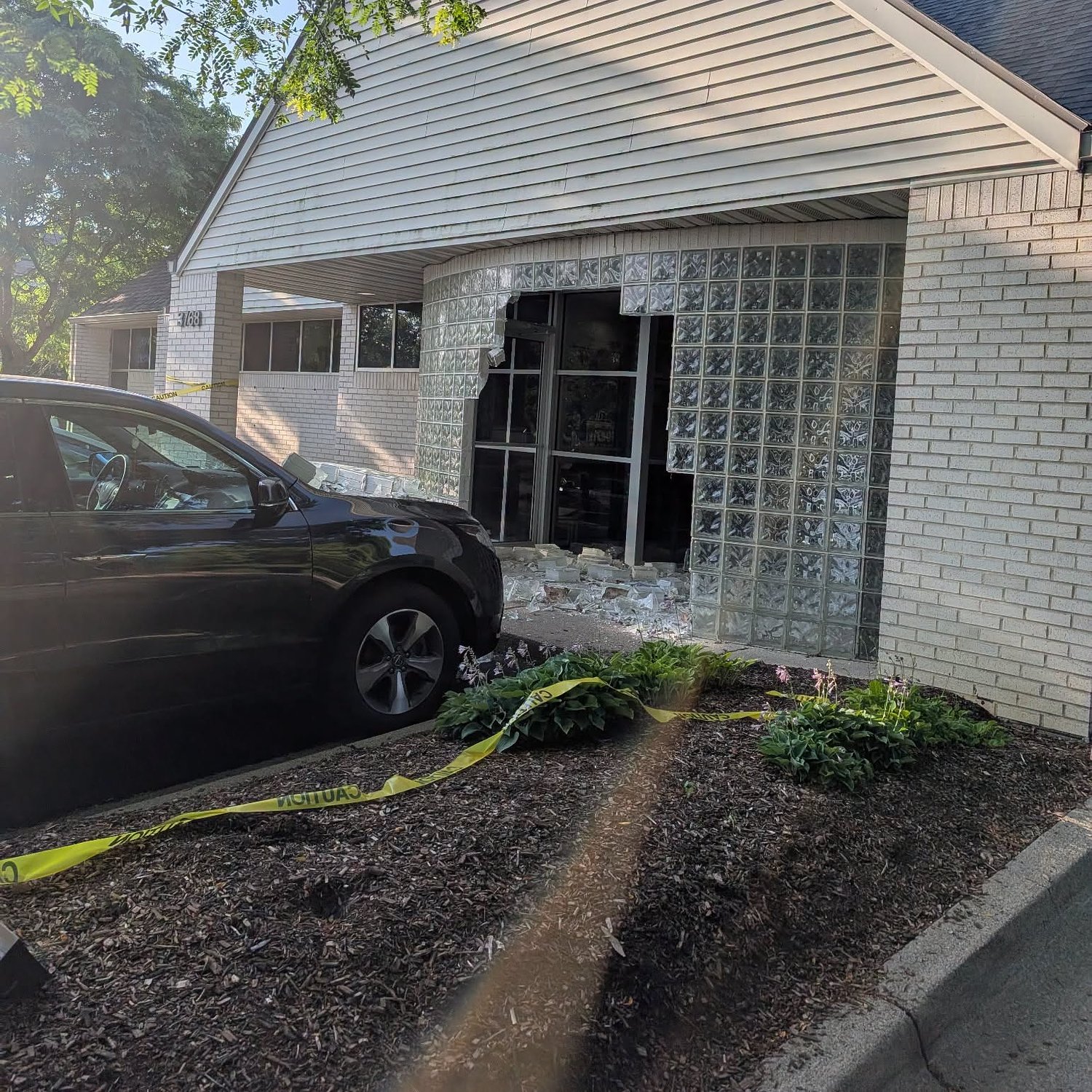 Car crashes into Ann Arbor business during parking attempt