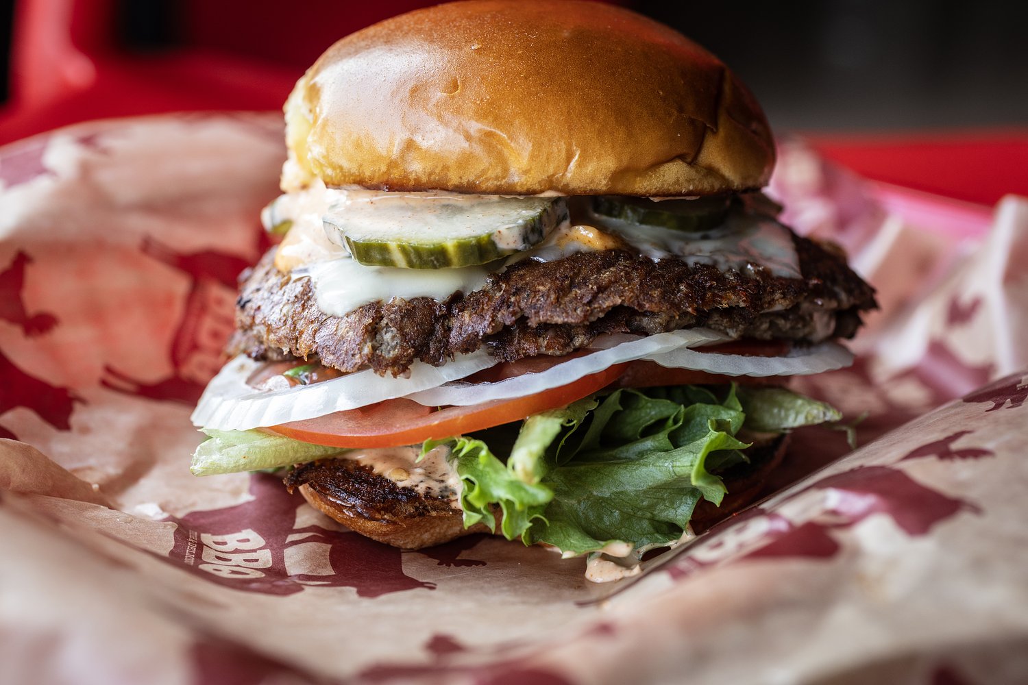 Indulgent brisket smash burger sits on a housemade bun: Best Eats