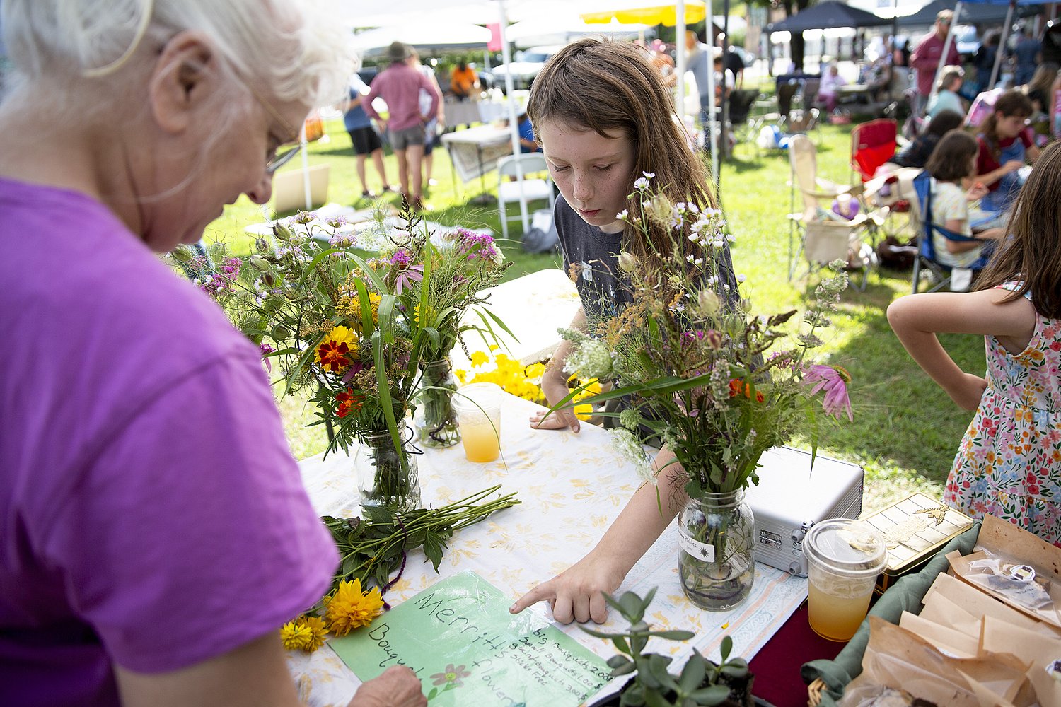 Kids rule at Chelsea Farmer's Market, selling flowers, poems and magic popcorn