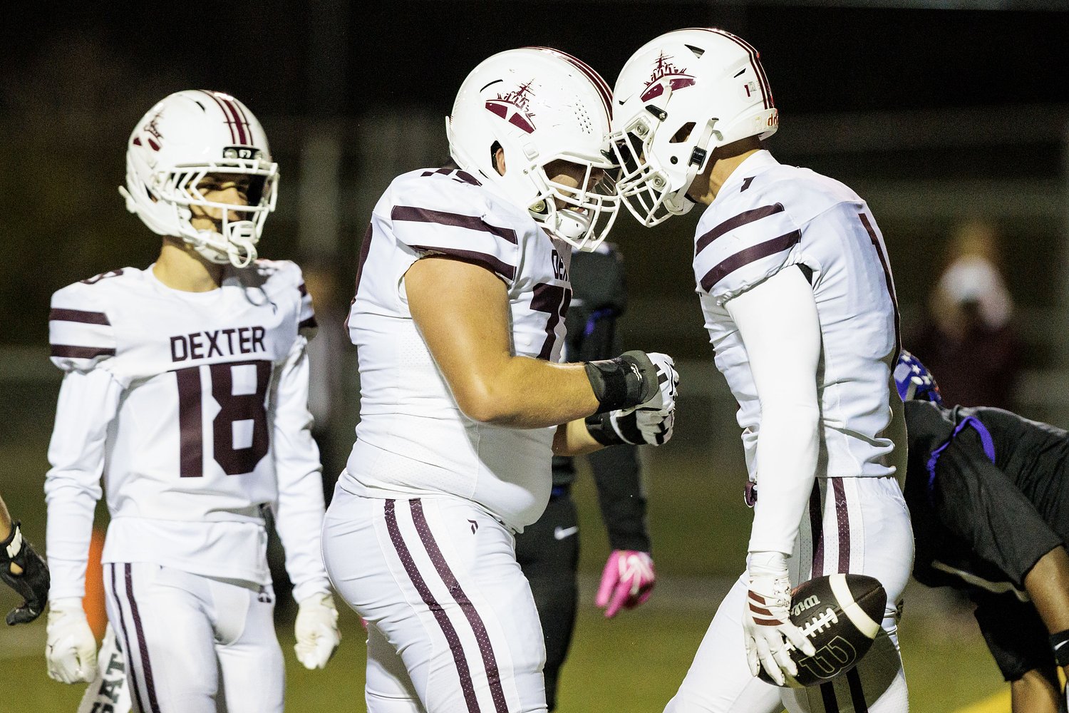 Simulate postseason paths for Ann Arbor-area football teams
