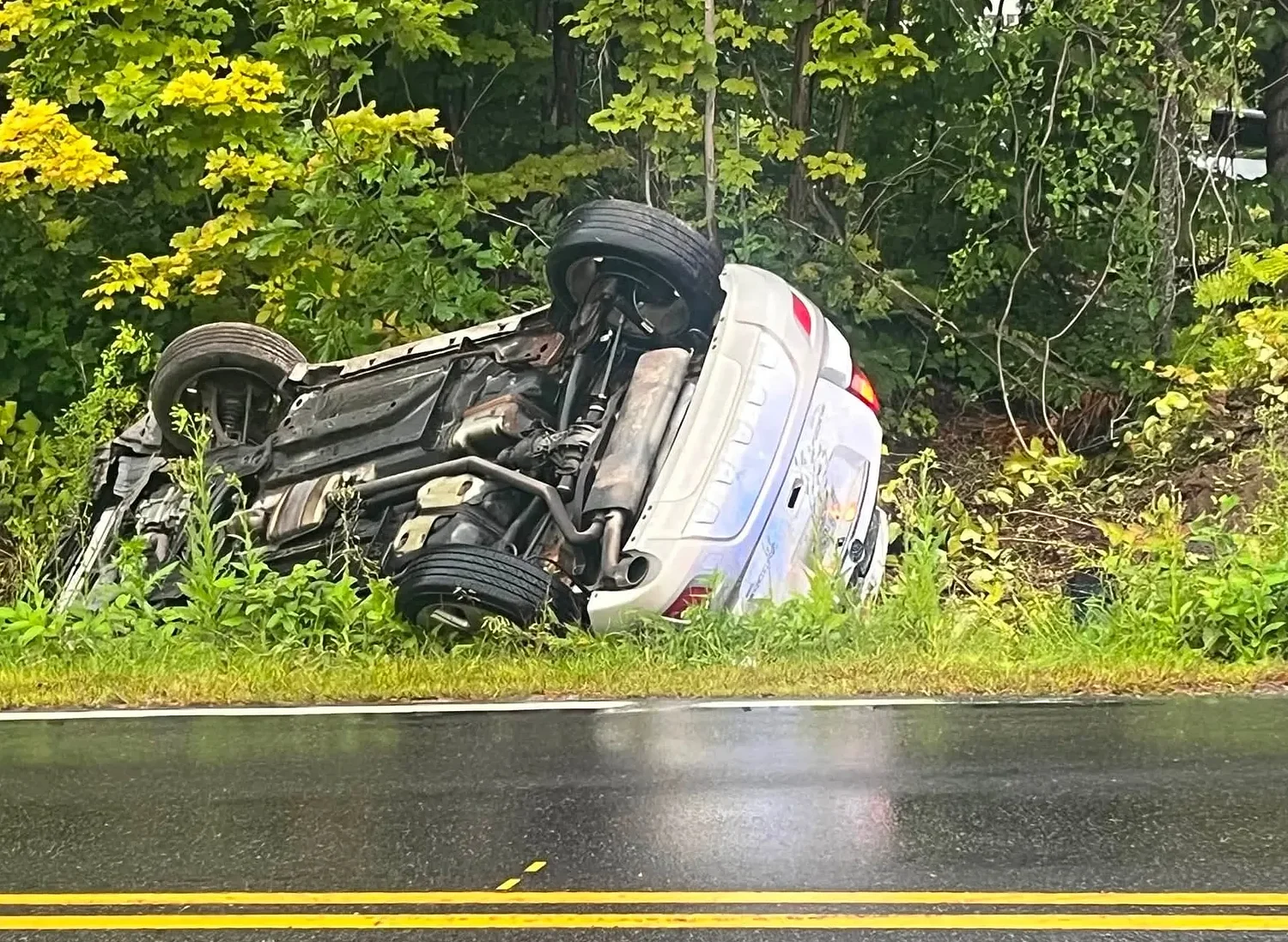 Driver escapes serious injury after flipping car in downtown Antrim