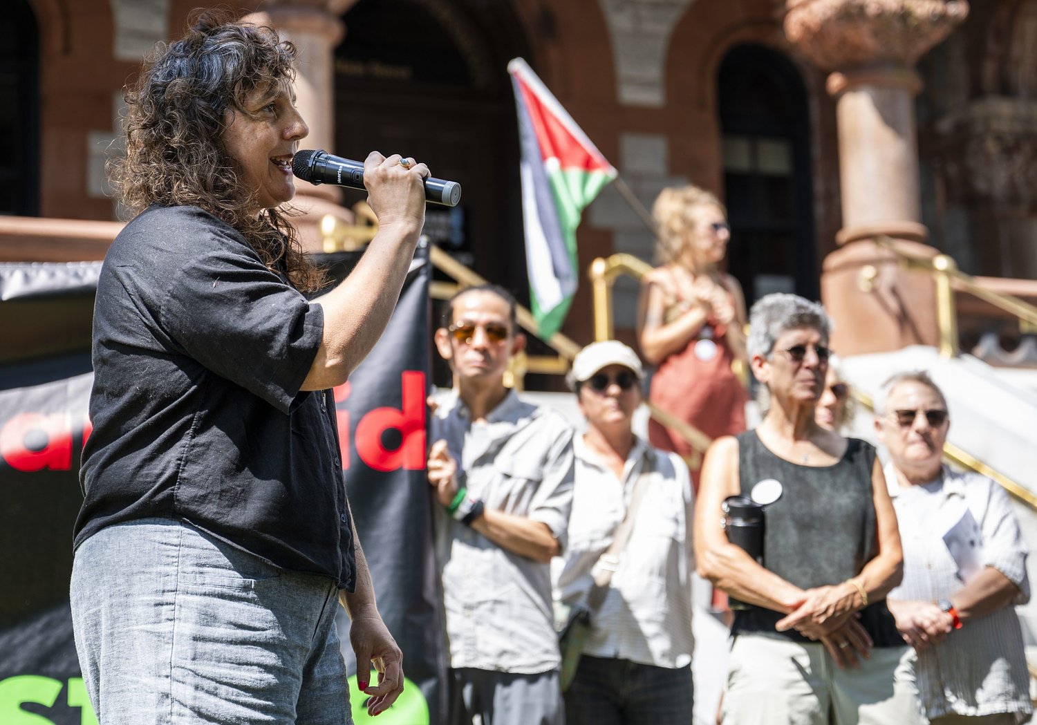 Judge weighs Northampton divestment lawsuit after supporters rally