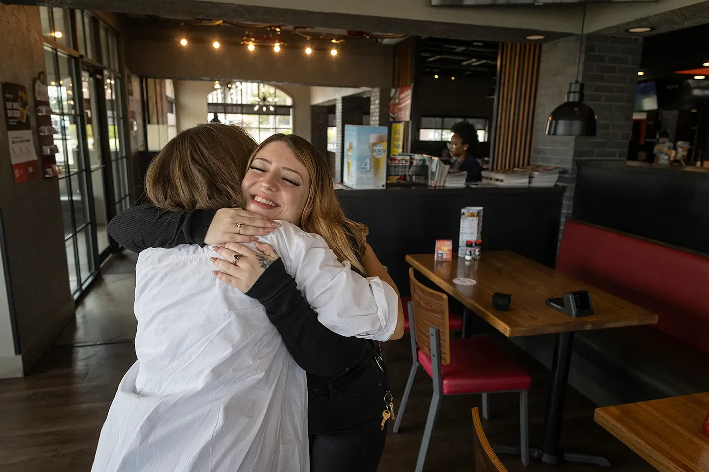 For some Wichita restaurant workers, the path to the American Dream includes a coach