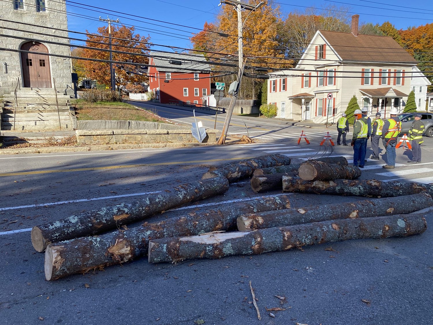 Logging truck clips utility pole and spills logs, snarling north Concord traffic