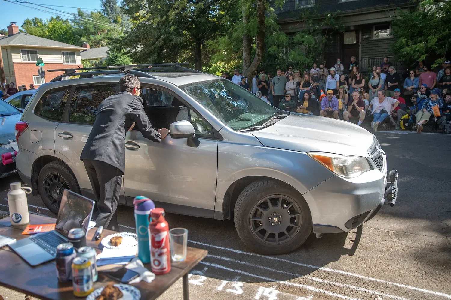 Hundreds pack Portland street to watch people parallel park