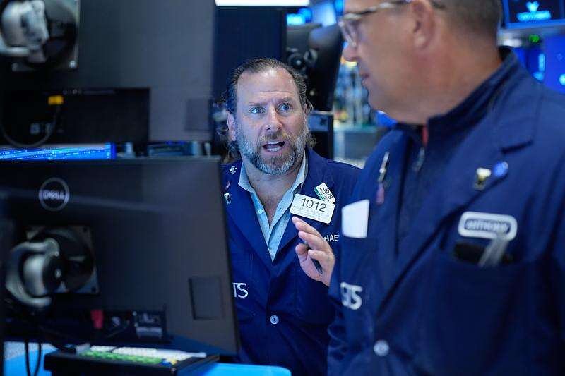 Wall Street holds near its record after Brent oil briefly falls below $98 per barrel