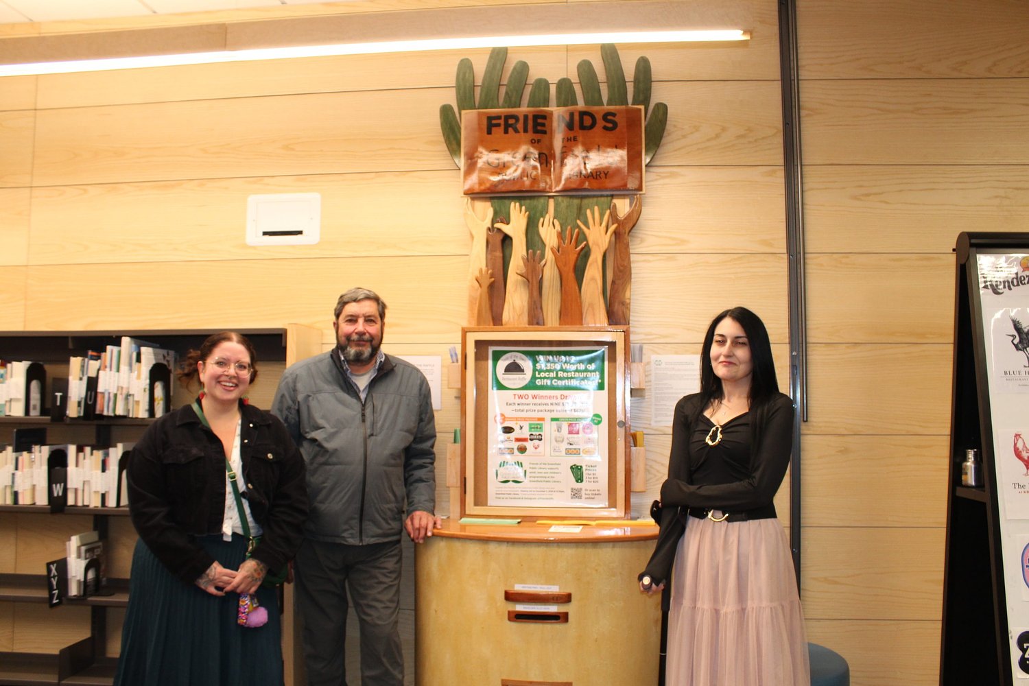 An example of vision, dedication and sanding prowess: Library Friends group unveils sculptural kiosk in Greenfield