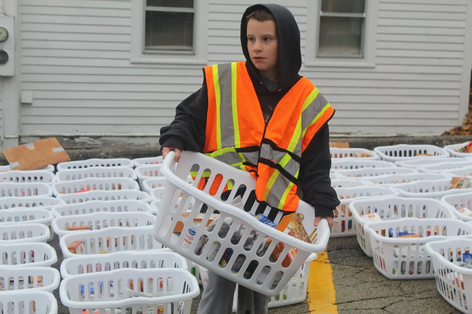 Volunteers distribute 191 Thanksgiving baskets at St. Vincent de Paul Food Pantry