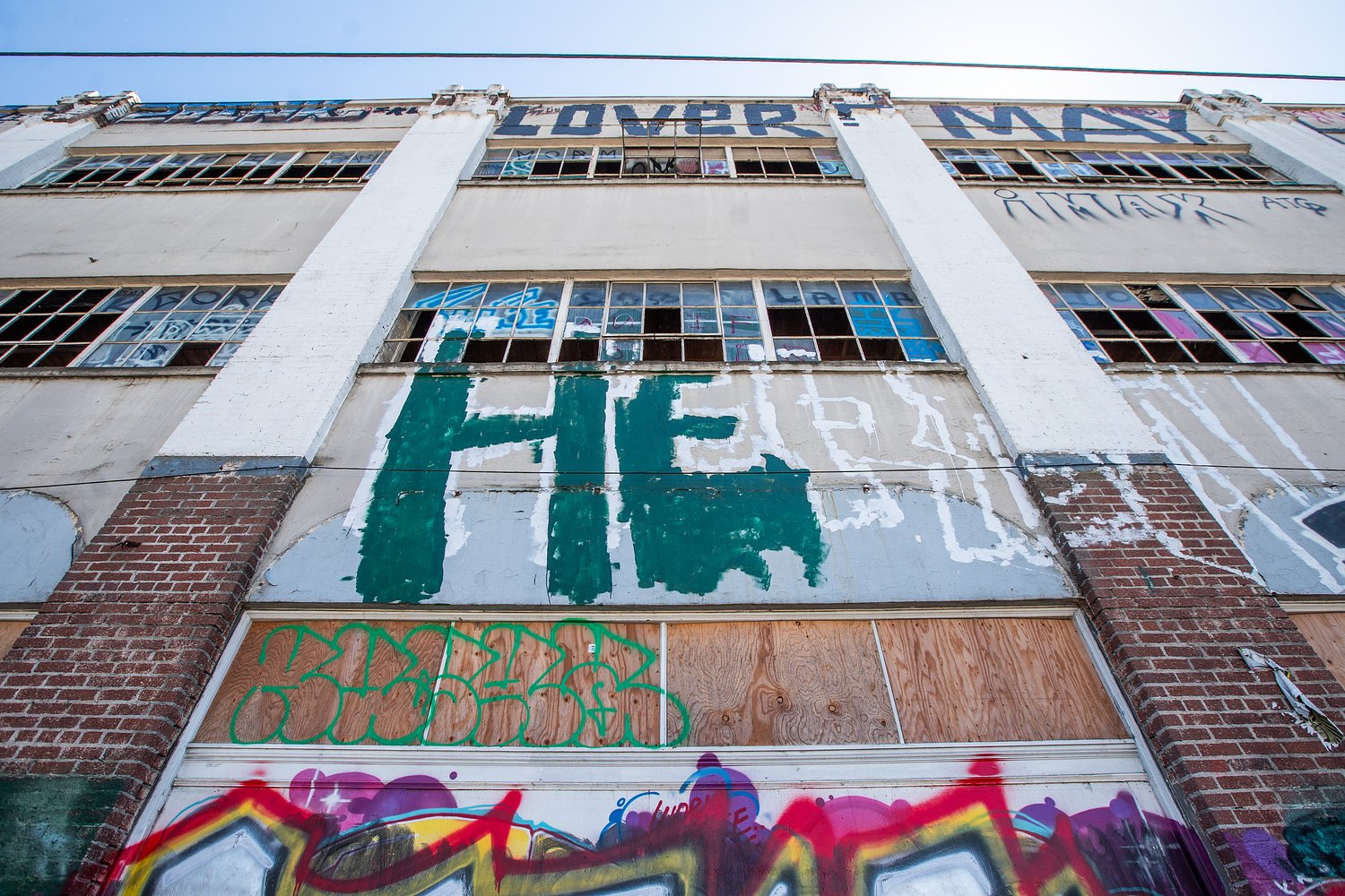 Contractors clean graffiti from a conspicuous Portland eyesore